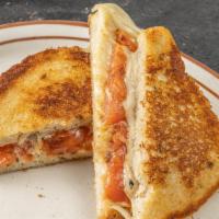 Grilled Cheese With Tomato  Sandwich Deluxe · Choice of cheddar, American, Swiss, mozzarella or Muenster.