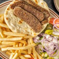 Gyro Sandwich · Choice of beef or chicken gyro served on a pita bread with lettuce, tomato and onion, topped...