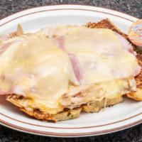 Monte Cristo · Challah bread French toast with white meat turkey, Swiss cheese and ham, grilled to perfecti...