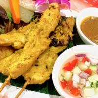 Chicken Satay · Grilled marinated chicken tender w/peanut sauce and cucumber relish