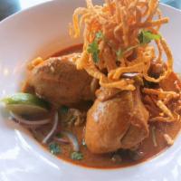 Khao Soi Chiang Mai Chicken** (Noodle Curry) · Traditional Northern Style Egg Noodle with Stew chicken drumstick in the unique curry, pickl...