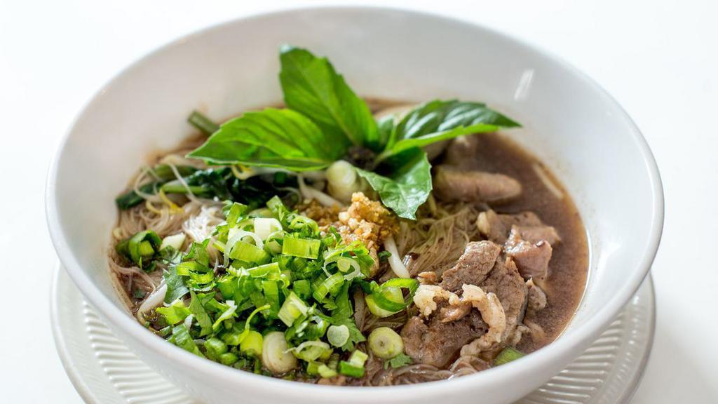 Boat Noodle (Beef Broth) · Thai style noodle with strong and very rich flavor with 2 hours stew beef shank as well as dark soy sauce, bean sprout, Chinese broccoli , cilantro, scallion and Chinese celery