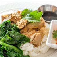 Khao Nar Ped (Duck Over Rice) · A roasted quarter of Long Island duck w/chef's special gravy sauce over rice and side of pre...