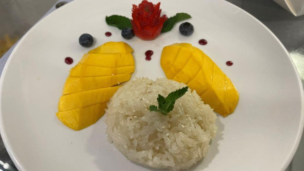 Mango Sticky Rice · Sweet sticky rice with mango and coconut milk.