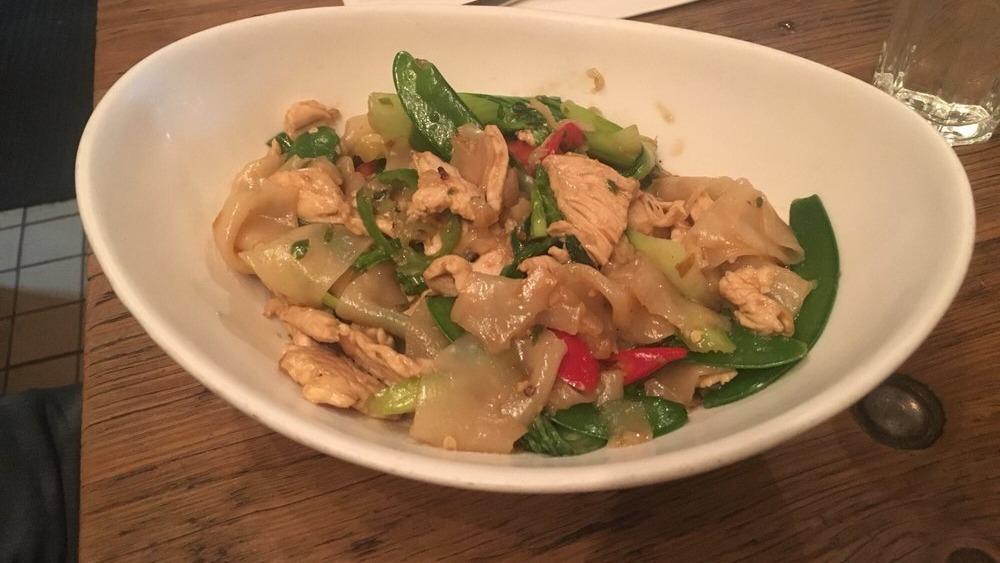 **Pad Kee Moa · Medium spice. Flat rice noodles, tomato, baby bok choy, snow pea, chili puree and Thai basil.

Please inform us of any allergies.
Contains gluten and shellfish.