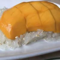 Mango With Coconut Sticky Rice · Champagne mango with coconut sticky rice topped with sesame seeds.

Please inform us of any ...