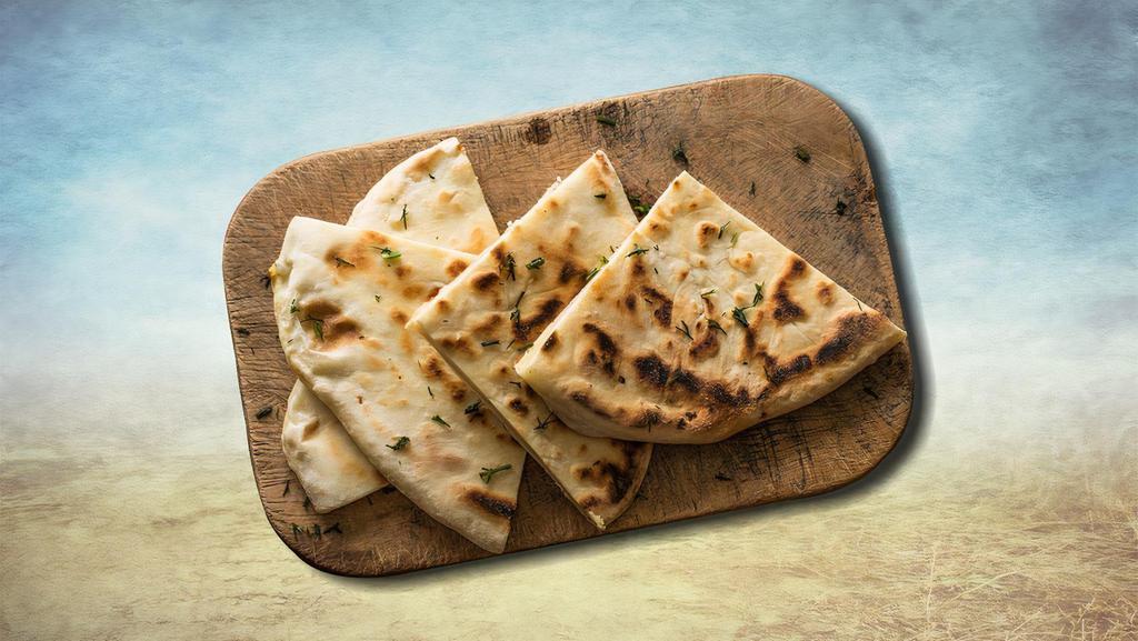 Just Pita · A yeast-leavened round flatbread baked out of wheat flour served as aside.