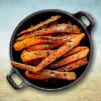 Sweet Potato Fries · Sweet potatoes evenly cut and then fried till crisp and golden topped with sea salt, garlic ...