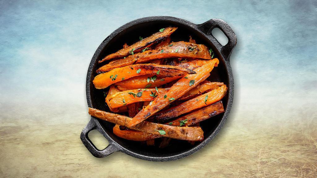 Sweet Potato Fries · Sweet potatoes evenly cut and then fried till crisp and golden topped with sea salt, garlic powder, and peppers.