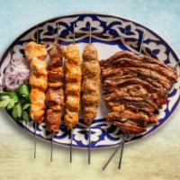 Chicken & Lamb Combination Plate · The carnivore's combination plate has a mix of meat both chicken and lamb gyro cooked in our...