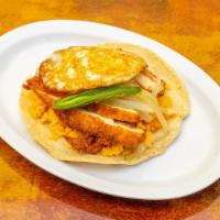 Breaded Chicken · Hand made tortilla with rice,fried egg , jalapeño and fried onions.