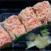 Phoenix Roll · Inside: shrimp, mango, and avocado; spicy crabmeat on the outside .