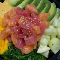 Tuna Salmon Bowl · Tuna, salmon, cucumber, avocado, mango, and seaweed salad. Served with spicy yuzu shoyu.