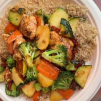 Glazed Salmon Bowl · Grilled salmon, carrots, zucchini, broccoli, sun dried tomatoes, and teriyaki glaze over bro...