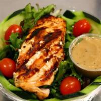 Balsamic Salmon Salad · Grilled salmon filet, mixed greens, tomatoes, cucumbers, and creamy balsamic. Add extra chic...