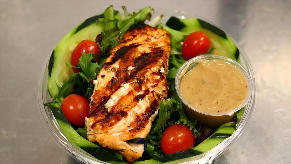 Balsamic Salmon Salad · Grilled salmon filet, mixed greens, tomatoes, cucumbers, and creamy balsamic. Add extra chicken, steak, or salmon for an additional charge.
