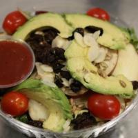 Cancun Salad · Vegetarian. Mixed greens, avocado, tomatoes, raisins, apples, almonds, sunflower seeds, and ...