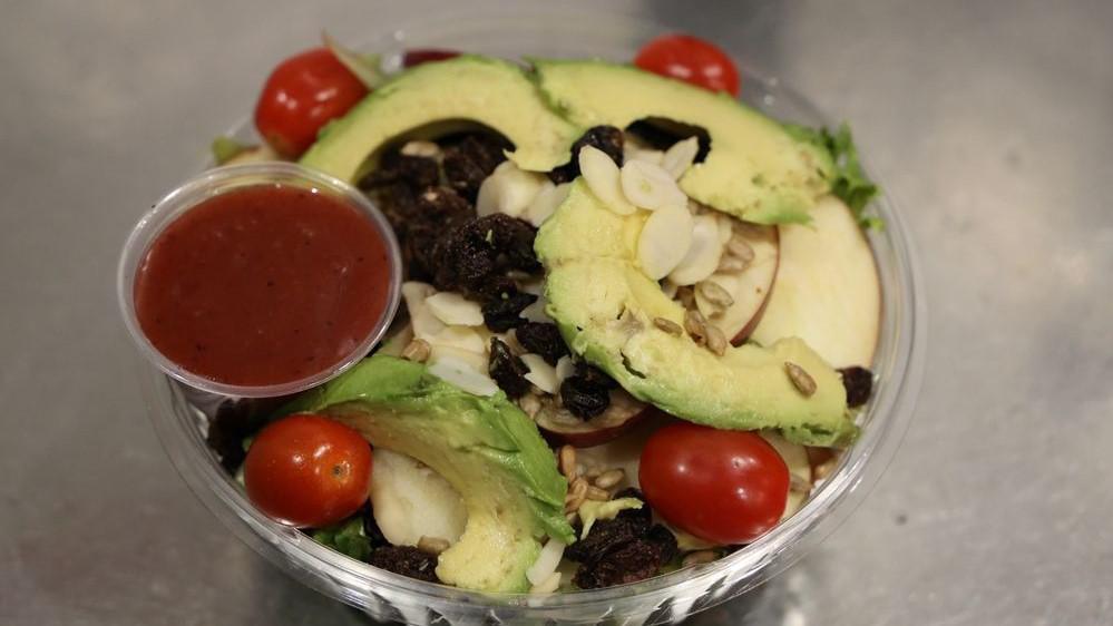 Cancun Salad · Vegetarian. Mixed greens, avocado, tomatoes, raisins, apples, almonds, sunflower seeds, and light raspberry dressing. Add extra chicken, steak, or salmon for an additional charge.