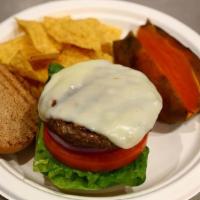 Bison Burger · Premium lean Canadian bison burger with lettuce, tomatoes, onions, and mozzarella. Served on...