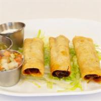 Taquitos · Three crispy rolled corn tortillas filled with shredded chicken or beef served on a bed of l...