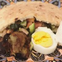 Sabich Sandwich · Tahini, amba, eggplant, hard boiled egg, Israeli salad.