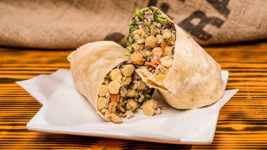 Super Vegan Wrap · Homemade chickpea salad, ancient grains, sunflower seeds, shredded carrots and mixed greens on sun dried tomato basil wrap.