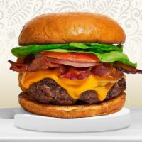 Shakin' For Bacon Burger · American beef patty topped with melted cheese, layers of crispy bacon, lettuce, tomato, onio...