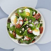 Spinach Salad · Bed of baby spinach with selected toppings.