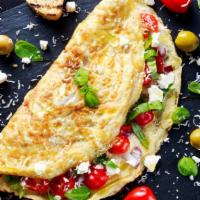 Greek Omelette · Greek style omelette with feta cheese, olives, tomatoes, onions and peppers.