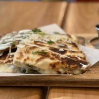 E 2. Quesadilla Gigante · Your choice of steak or chicken, sandwiches between two flour tortillas with melted cheese, ...