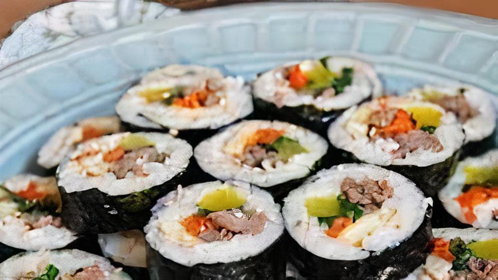 Beef Kimbap · Korean style roll with beef short rib, carrots, cucumbers and pickled daikon rolled with rice in seaweed