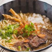 Gyukotsu Ramen · Beef bone marrow broth, soy sauce tare, braised short rib beef, scallions, sweet onions, and...