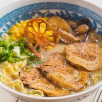 Miso Ramen · Chicken broth, miso tare, pork belly, sweet corn, shiitake mushrooms, and scallions. Wavy eg...