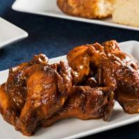 Chipotle Chicken Wings · The original Blue Smoke icon. Smoked jumbo wings are fried 'til crispy, with smoky  & spicy ...
