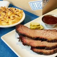 Half-Pound Beef Brisket Meal · Rubbed with salt & pepper and hickory smoked. Half-Pound.  Served with a corn muffin and cho...