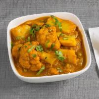 Aloo Gobhi · Potato and cauliflower curry cooked in traditional style.