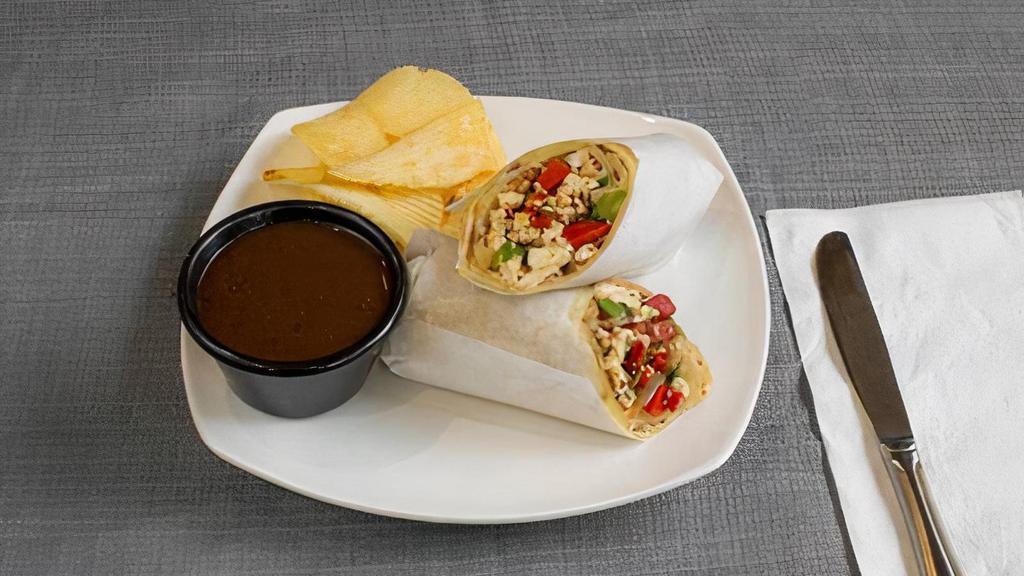 Tofu Masala Roll · Tofu, tomato, onions, peppers topped with cilantro, cumin and masala mix. Comes with tamarind sauce.