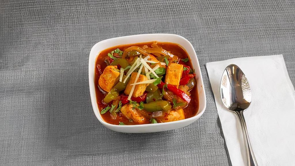 Spicy Chili Tofu · Tofu, broccoli, cooked with onions, red and green pepper and chili sauce.