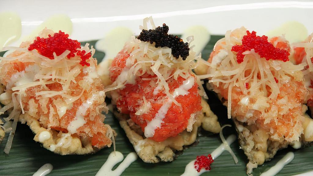Kinha Wasabi Cracker · Spicy tuna and salmon on wasabi seaweed cracker.