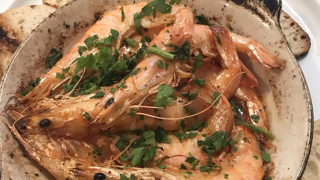 Clay Pot Shrimp · Shrimp with roasted garlic, olive oil, and chef's spices, finished with butter sauce.