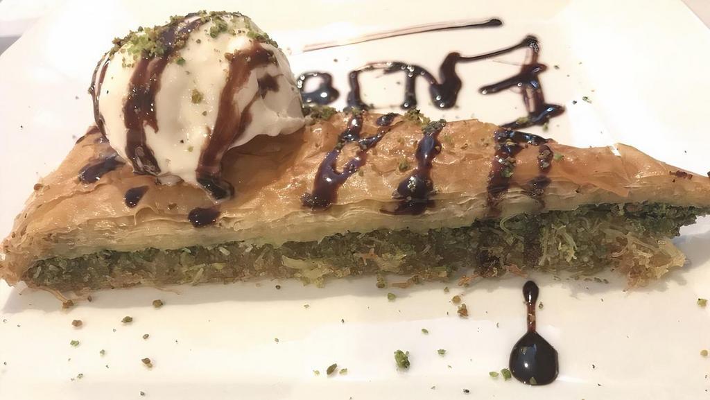 Baklava · Flaky pastry and crushed pistachios in syrup.
