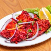 Chicken Tikka · Boneless white breast chunk of chicken delicately flavored and broiled in the tandoor.