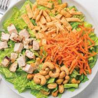 Large Asian Sesame Salad With Chicken · Fresh romaine with grilled lemon garlic chicken, topped with cashews, matchstick carrots, wo...