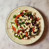 Greek Salad · Warm grilled chicken, olives, feta cheese, chickpeas, and cucumbers.