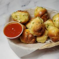 Garlic Knots · Homemade twisted dough baked with fresh garlic, extra virgin olive oil, Italian spices, and ...