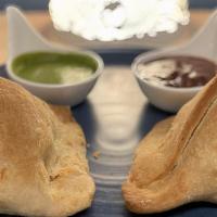 Samosa · potato & peas in a crispy baked pastry with tamarind & date chutney.