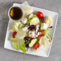 Greek Salad · Mixed greens, cucumbers, tomatoes, olives, red onions, and feta cheese.