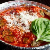 Meatballs And Ricotta · Served with cooked tomato sauce, garnished with grated cheese and topped with ricotta cheese.