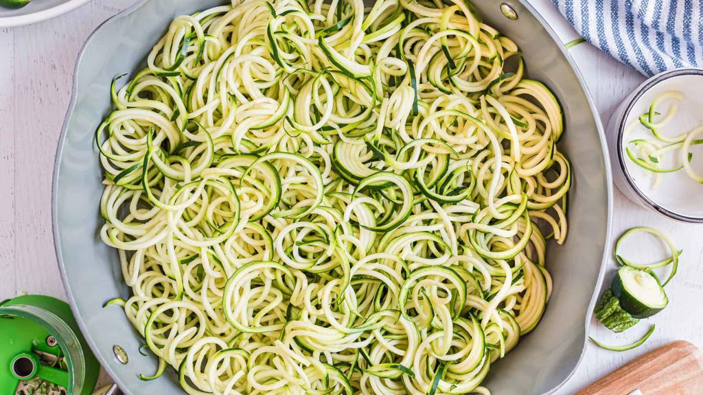 Zoodles · Veggie ribbons. Linguine length shredded carrots, zucchini zoodle noodles. Lightly sautéed with extra virgin olive oil, fresh garlic and diced tomatoes.