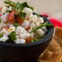 Fish Ceviche Bowl · Citrus cured fish with cabbage, onion, cilantro & tomatoes topped with guacamole & chipotle ...